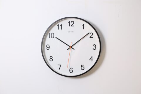 A clock on a white wall